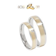 Karikagyűrű 14 k  fehér és sárga aranyból, a női kövekkel díszítve.