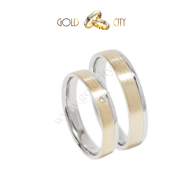 Karikagyűrű 14 k  fehér és sárga aranyból, a női kövekkel díszítve.
